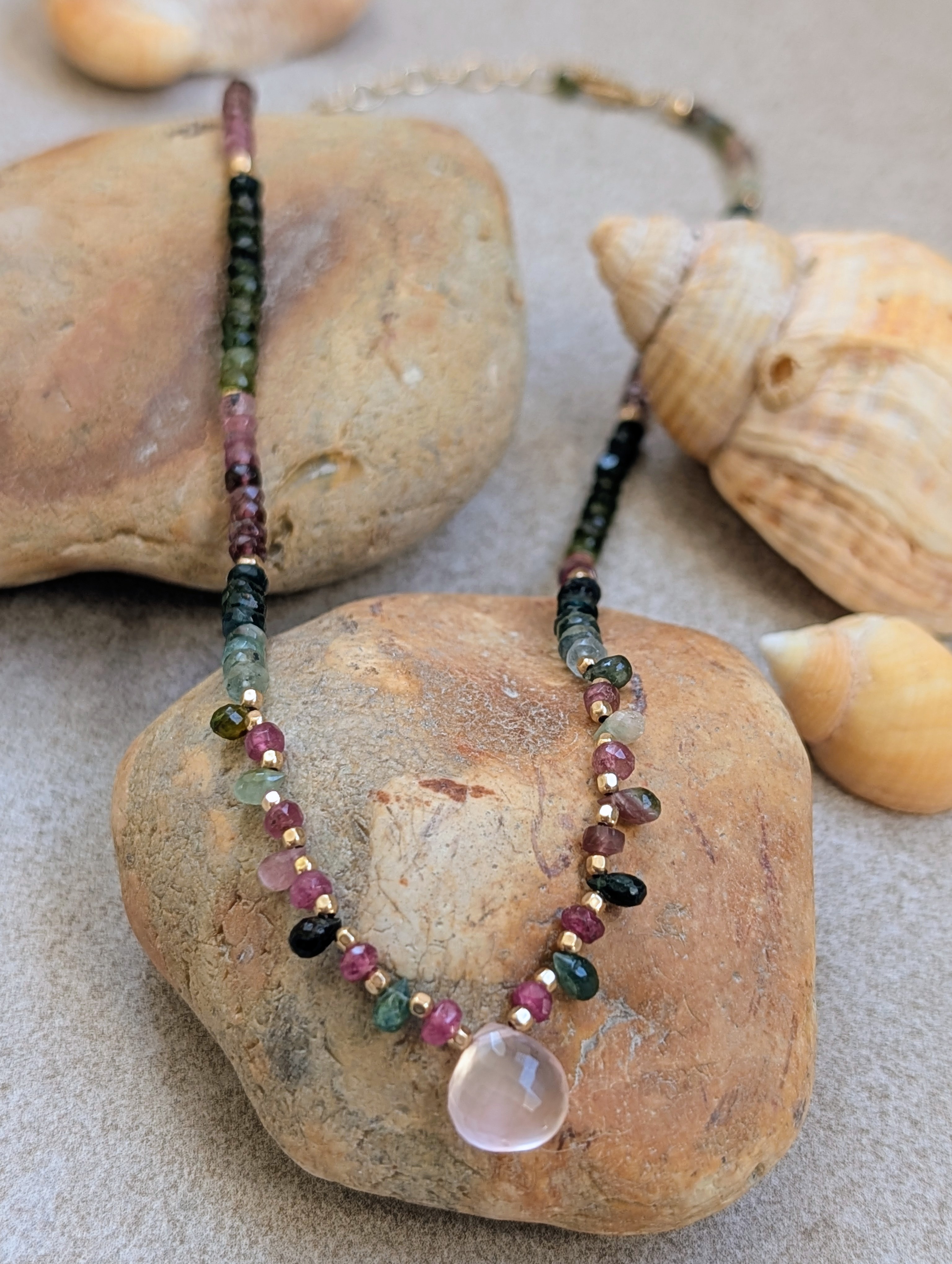 The Phoebe Talisman on River Stones and Seashells Composition
